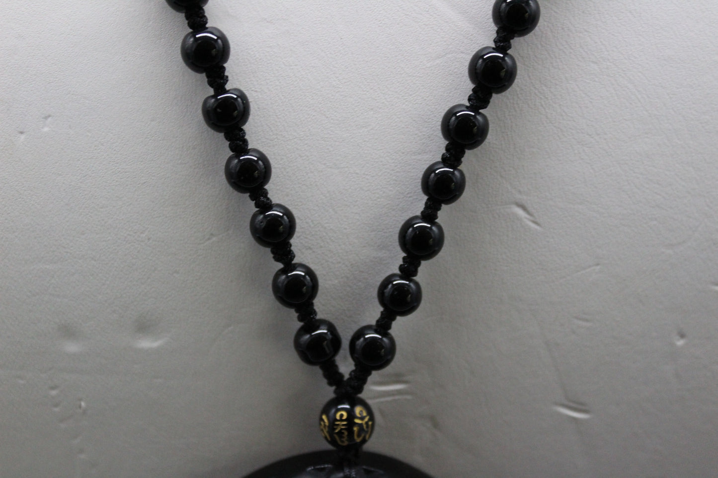 Carved Obsidian Disc with bead accents