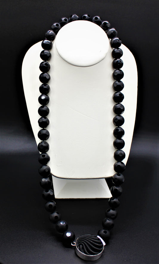 Dalmatian Cut Onyx Beads with design woven clasp.
