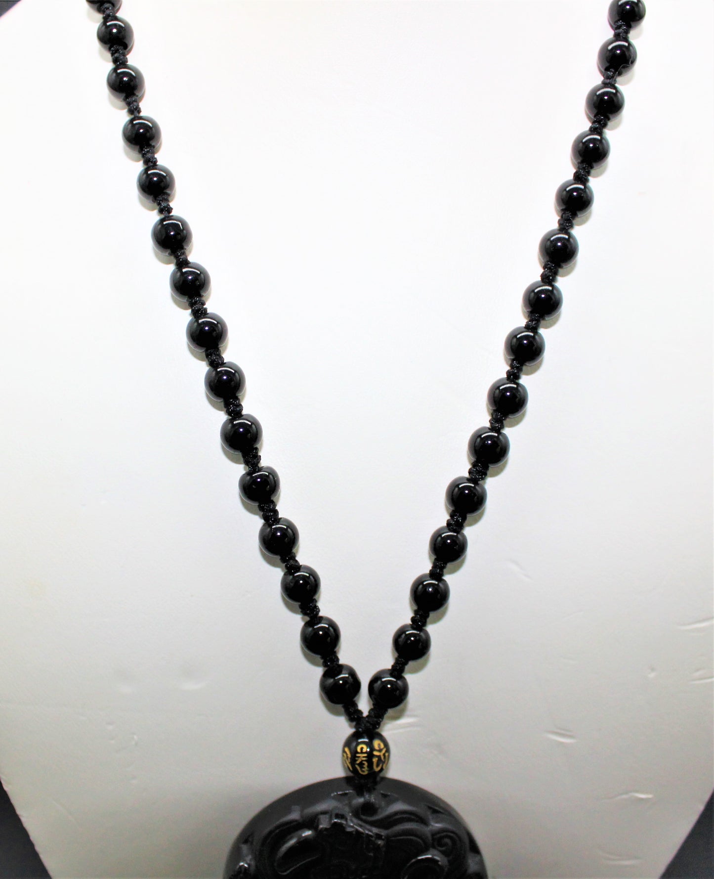 Carved Obsidian Disc with bead accents
