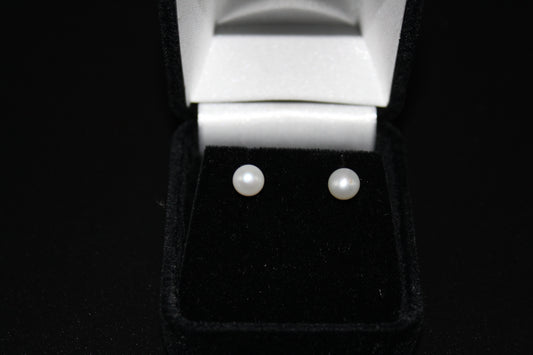 These 14kt yellow gold post and friction backed 6mm white fresh water pearl earrings have very nice luster.